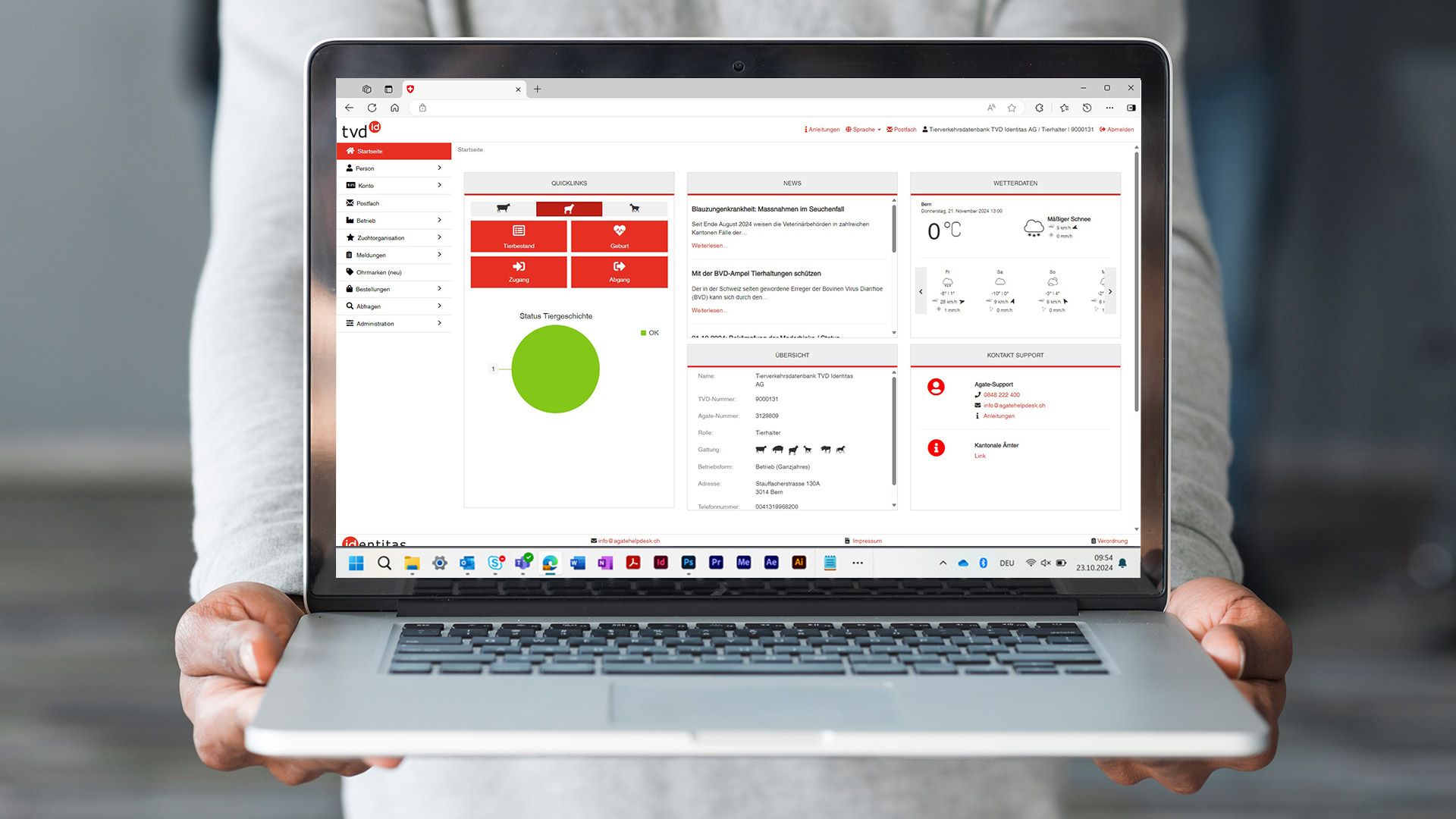 A screenshot of the Animal Tracing Database application is displayed on a laptop.