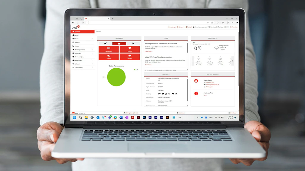 A screenshot of the Animal Tracing Database application is displayed on a laptop.